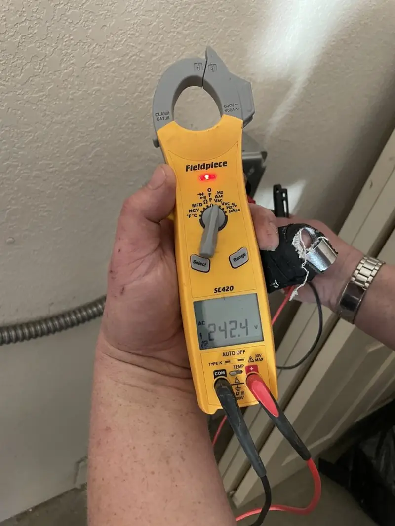 Voltage testing with clamp meter during Generator Installation in Bear Creek